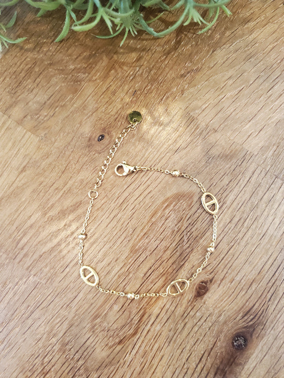 Bracelet KFE chaine fine colorie or. photo a plat.