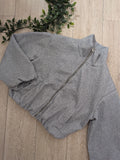 blouson court en tissus feutré colorie gris.