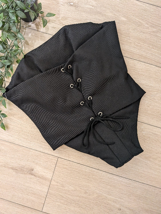 Bustier corset noir . photo a plat dos.