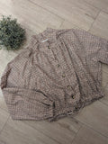 Blouson pied de poule marron . photo a plat