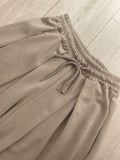 Jogging a pli. colorie beige . photo a plat. 