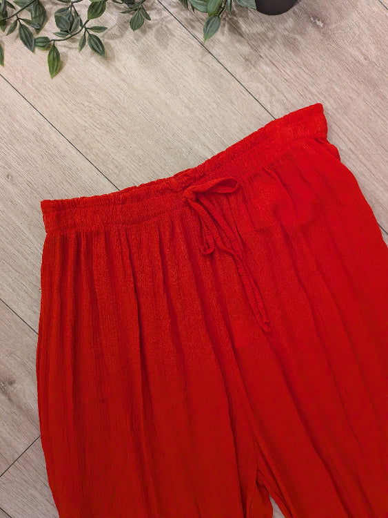 Pantalon fluide corail. photo a plat détail