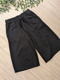 Bermuda jogging colorie noir, photo a plat. 