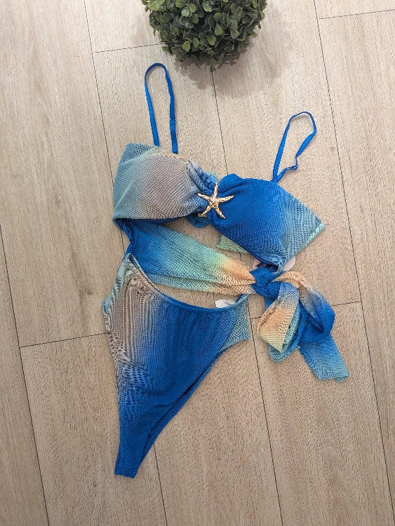 Ensemble composé d'un body et d'une jupe en voile imprimé. photo du body. Colorie bleu